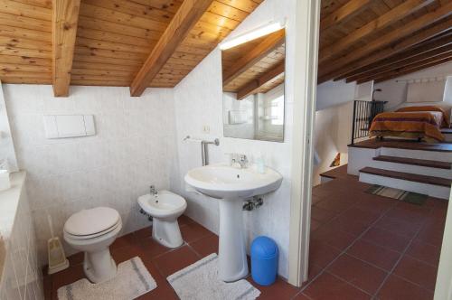 a bathroom with a toilet and a sink at Donna Lina in Matera