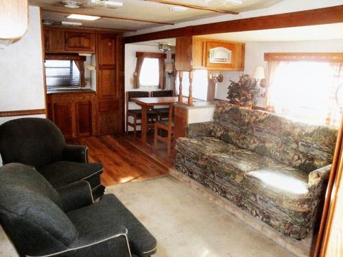 a living room with a couch and a table at Dark Ridge HideOut in Elk Park