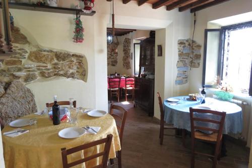 a dining room with two tables and chairs in a building at B&B Dal Brillante in Seravezza