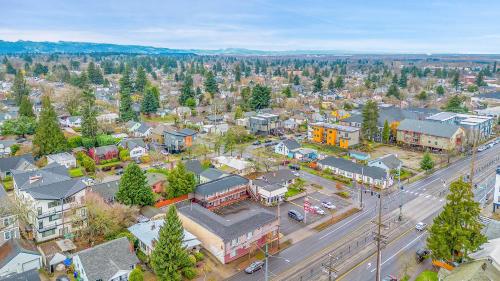 an aerial view of a town with a street at Viking Motel in Portland
