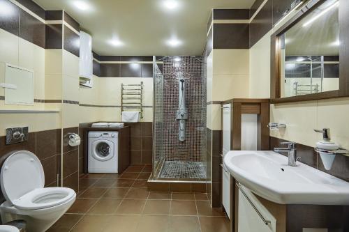 a bathroom with a toilet and a sink and a shower at Botanic Towers the house has a shelter in Kyiv