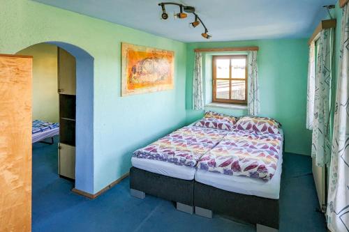 a bedroom with a bed and a window at Private Farmhouse Escape - Ideal for up to 8 Guests in Seeham