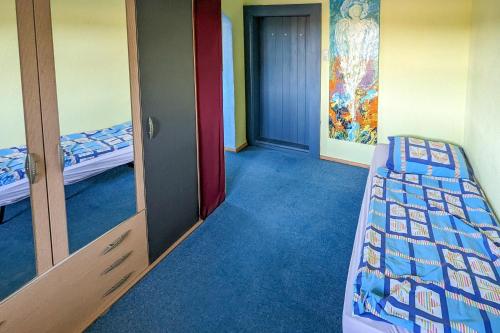 a room with two bunk beds and a doorway at Private Farmhouse Escape - Ideal for up to 8 Guests in Seeham