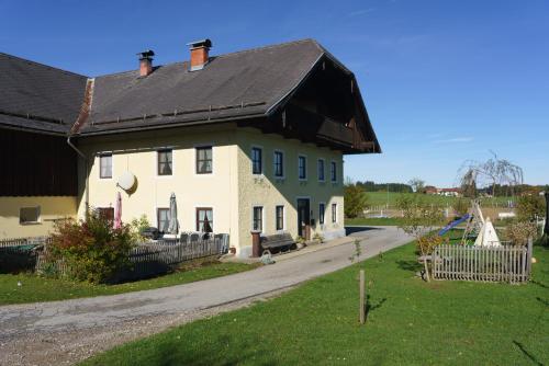 a large white house with a black roof at Private Farmhouse Escape - Ideal for up to 8 Guests in Seeham