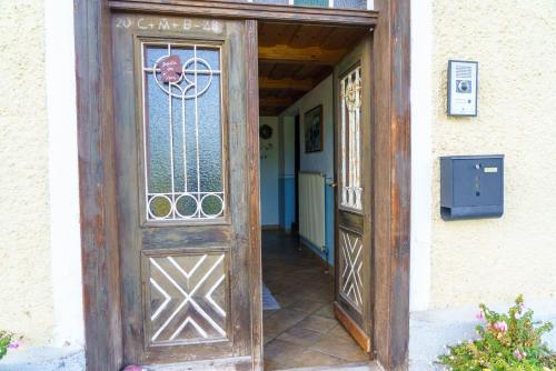 an entrance to a house with a wooden door at Private Farmhouse Escape - Ideal for up to 8 Guests in Seeham