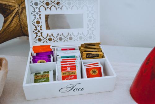 a white box filled with different types of tea at Dimora Pardo in Larino