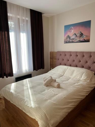 Ένα ή περισσότερα κρεβάτια σε δωμάτιο στο Apartman Trojka