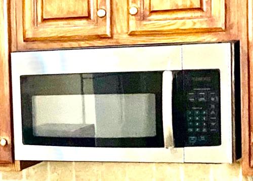 a black and white microwave in a kitchen at B1 A private room in Naperville downtown with desk and Wi-Fi near everything in Naperville