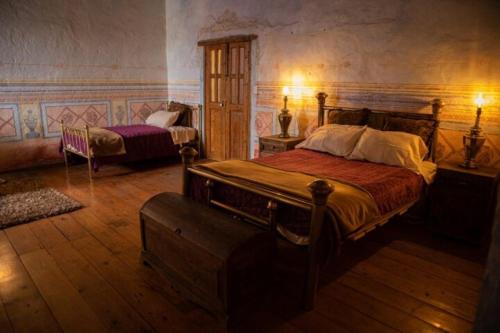 Una cama o camas en una habitación de Habitación en casa del siglo XVI