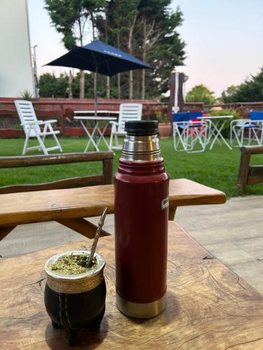 a ketchup bottle on a table with a bowl of food at hotel los ACANTILADOS in Mar del Plata