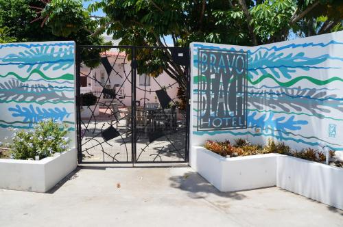 a fence that has a bunch of signs on it at Bravo Beach Hotel in Vieques