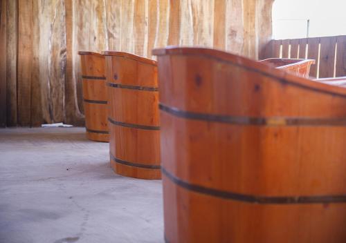 a group of wooden barrels sitting in a room at LUA Farmstay in Ba Ria