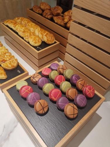 a display of donuts with basketball cookies and pastries at Vienna International Hotel - Shanghai World Expo Garden in Shanghai