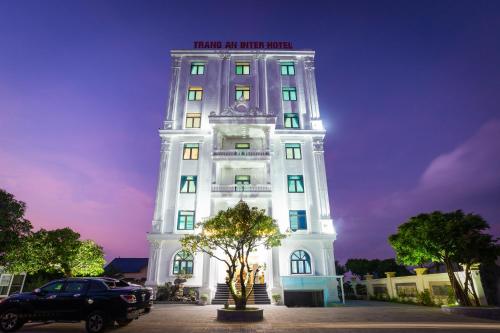 a white building with a sign on top of it at Trang An International Hotel in Ninh Binh