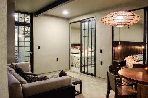 a living room with a couch and a table at Lofts Marques Oaxaca in Oaxaca City
