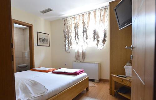 Postel nebo postele na pokoji v ubytování Motel Kneginja