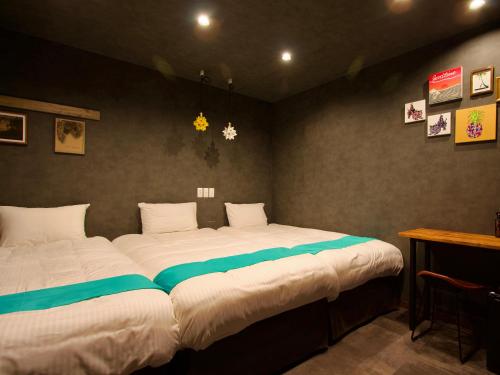 Una cama o camas en una habitación de MORIYA iriomote HOTEL