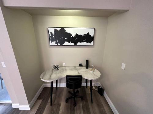a room with a table with a chair in it at Manatee Oasis Weeki Wachee Family Fun Pool Home in Spring Hill