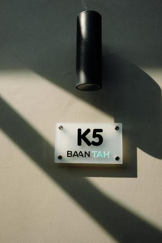 a sign that reads brain taxi hanging on a wall at Baan Tah On The Sea in Bang Sare