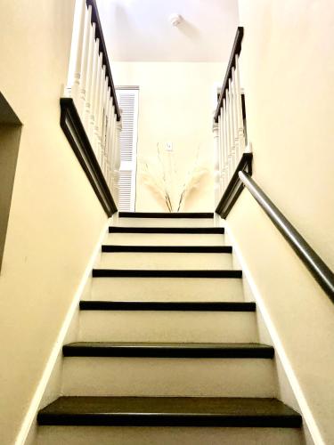 a set of stairs in a building at B4 A private room in Naperville downtown with desk and Wi-Fi near everything in Naperville