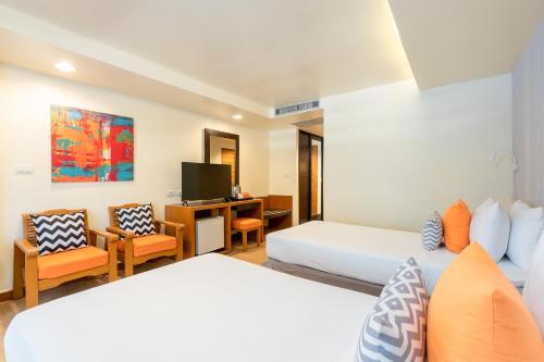 Ένα ή περισσότερα κρεβάτια σε δωμάτιο στο Sunshine Hotel & Residences