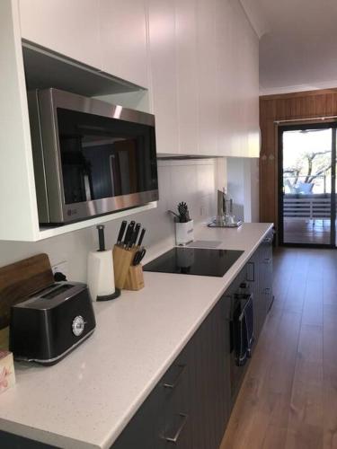 a kitchen with a sink and a counter top at Perfect Country Home in Tawonga