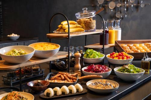 a buffet with lots of different types of food at Mercure Tokyo Haneda Airport in Tokyo