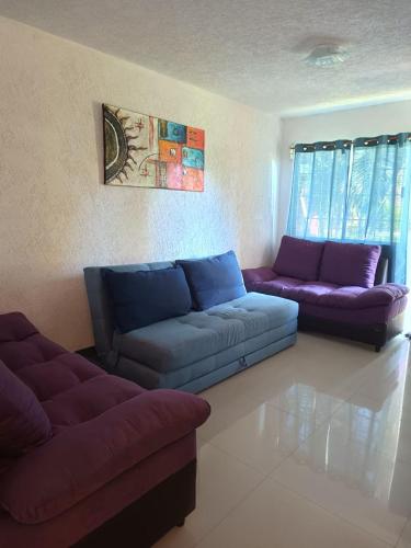 a living room with two couches and a couch at Casa el Palmar, the best house in Ixtapa in Ixtapa