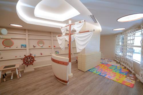 a childs room with a ship themed room at The Marin Phuket Kamala Beach in Kamala Beach