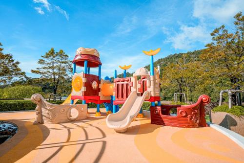 a childrens playground with a slide and a play structure at The Marin Phuket Kamala Beach in Kamala Beach