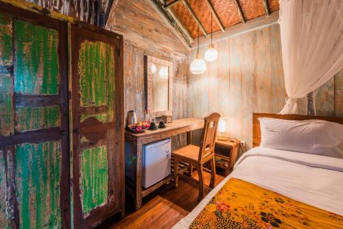 Katil atau katil-katil dalam bilik di Nauna Villa Ubud