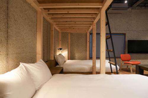 Ένα ή περισσότερα κρεβάτια σε δωμάτιο στο Green Room Hotel