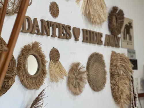 a wall with the words danties i hate amaan at Dante's Hideaway Guest House in Boracay