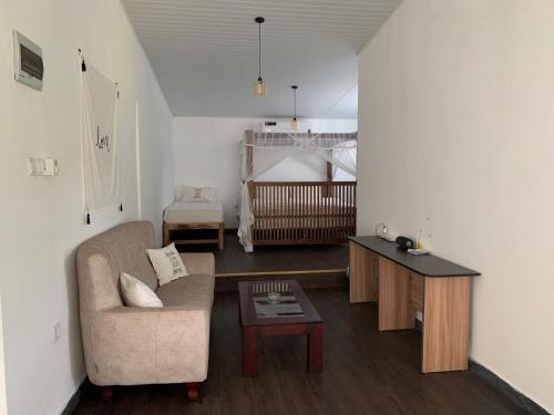 a living room with a couch and a table at My place Sri Lanka Apt Near Airport (CMB) in Katunayake