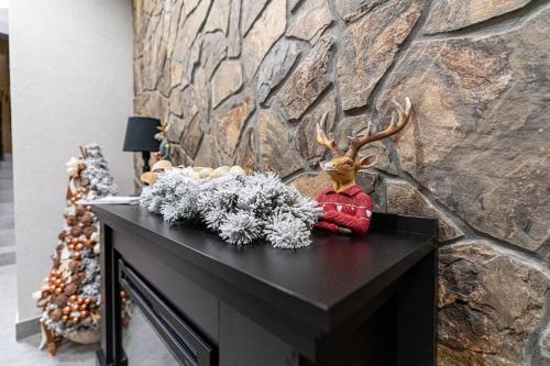 a reindeer sitting on top of a table at Willa Trawers in Zakopane