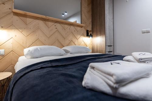 a bedroom with two beds with white pillows at Willa Trawers in Zakopane
