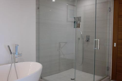 a bathroom with a shower and a toilet and a sink at Skyline Serenity Luxe Suite-Private Room in Los Angeles