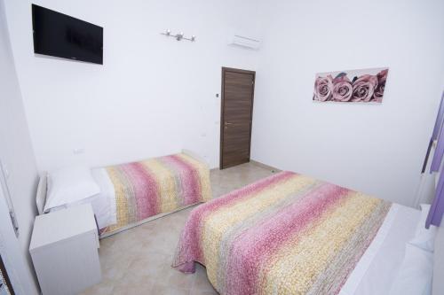 Кровать или кровати в номере La Casa Di Tina