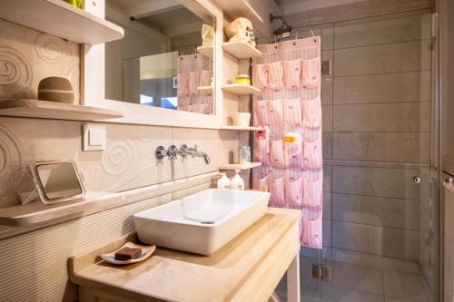 a bathroom with a sink and a shower at Luxury Duplex Villa w Pool and Garden in Alacati in Alaçatı
