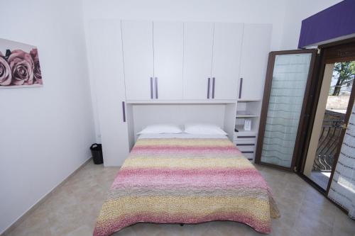 Кровать или кровати в номере La Casa Di Tina