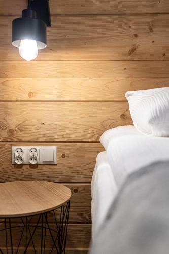 a room with two beds and a table at Willa Trawers in Zakopane