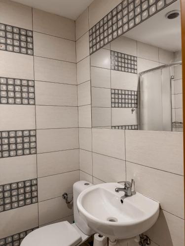 a white bathroom with a sink and a toilet at Willa Mia - pokój z prywatną łazienką in Wisła