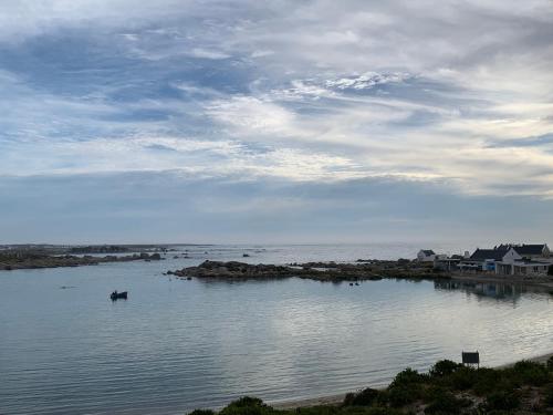 a body of water with a boat in it at Sea La Vie in Jacobs Bay