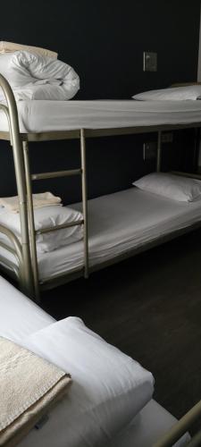 Una cama o camas en una habitación de Plug inn Montmartre by Hiphophostels