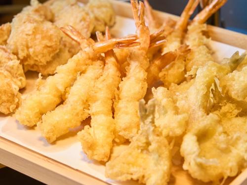 a plate of food with some shrimp on it at Hotel Musse Kyoto Shijo Kawaramachi Meitetsu in Kyoto