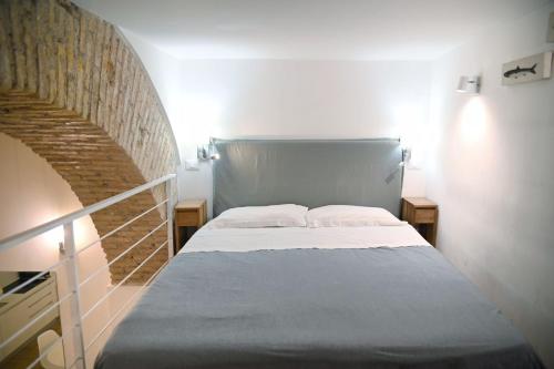 Giường trong phòng chung tại Via Veneto Luxury Loft