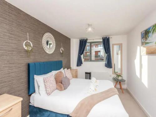 a bedroom with a bed with a teddy bear on it at Pass the Keys City Centre Retreat close to Christmas Markets in Leeds