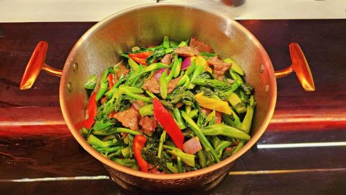 a pot full of food with meat and vegetables at Echarm PLUS International Hotel Zhujiang New Town Wuyangcun Metro Station Branch- Free Deliver Service to Canton Fair Complex During Canton Fair Period in Guangzhou