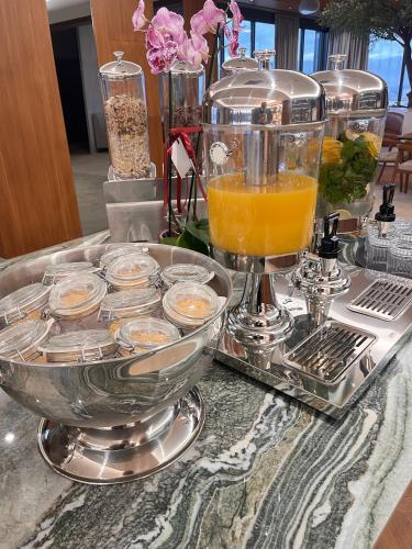 a tray of food and drinks on a table at Actor Hotel in Skopje