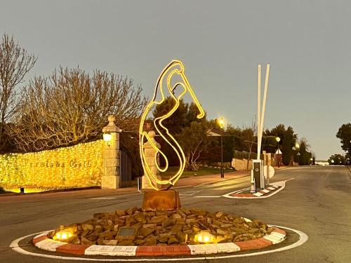 a statue of a woman sitting on top of a fountain at Villa Sol Luxury Costa Brava Golf in Peralada